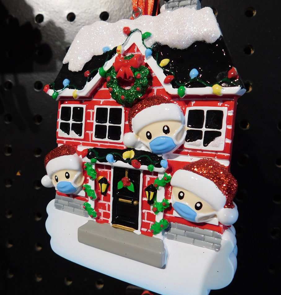 Family with masks on ornament